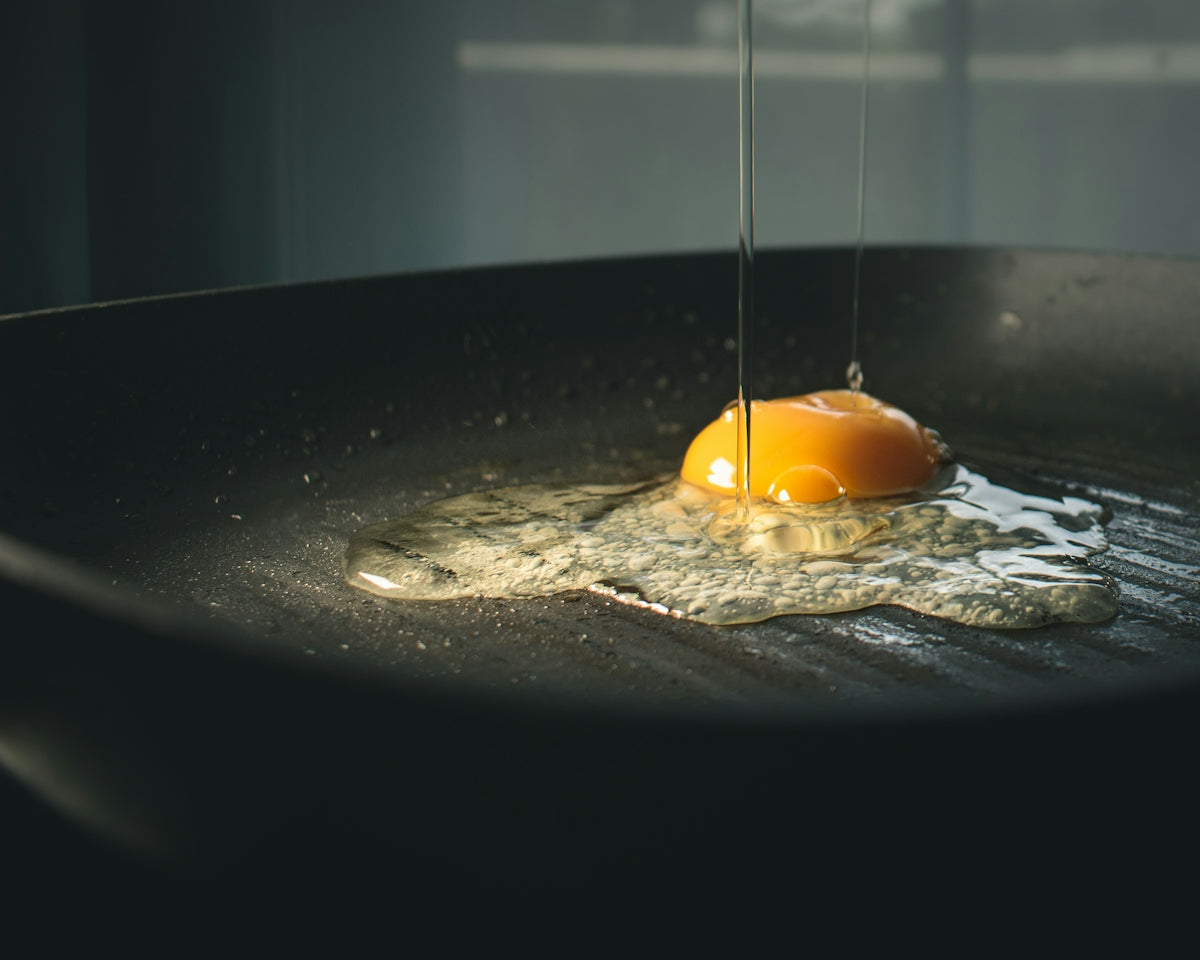 orange fruit on black pan